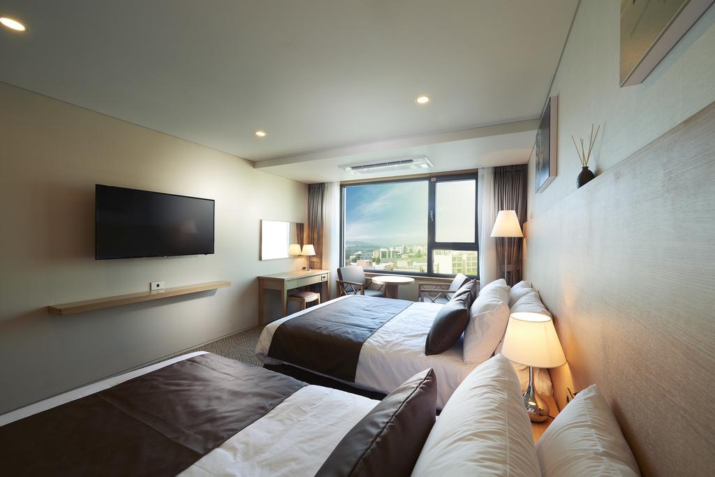 Benikea Jungmun Hotel Seogwipo Rum bild